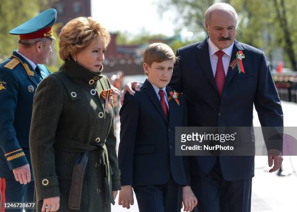 In this file picture, the President of Belarus, Alexander Lukashenko, and the First Lady, Galina, with their son Dmitry, seen at the Tomb of the...