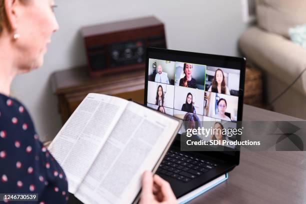 because of covid-19 social distancing, woman attends church by video - jesus talking stock pictures, royalty-free photos & images