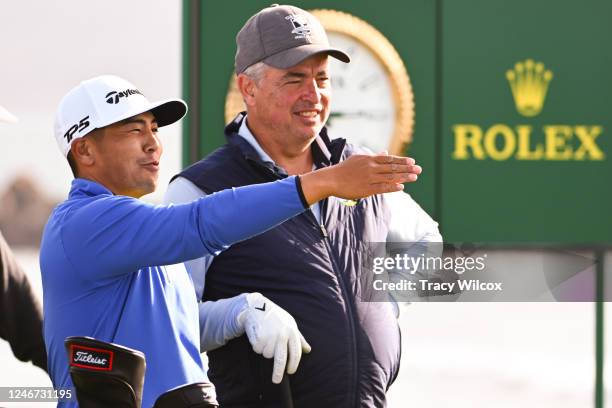 Kurt Kitayama and Eddy Cue at the 18th hole prior to the AT&T Pebble Beach Pro-Am at Pebble Beach Golf Links on February 1, 2023 in Pebble Beach,...