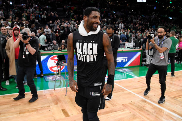 Kyrie Irving of the Brooklyn Nets smiles after the game against the Boston Celtics on February 1, 2023 at the TD Garden in Boston, Massachusetts....