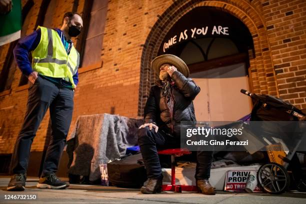 Unhoused Billy Jones speaks with volunteer Ari Hamilton while Hamilton is canvassing the Echo Park neighborhood during the 2023 Greater Los Angeles...