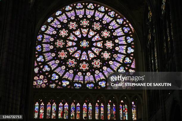 This picture taken on February 1, 2023 shows renovated stained glass windows at the Basilique de Saint-Denis, in Paris' northern suburb of...