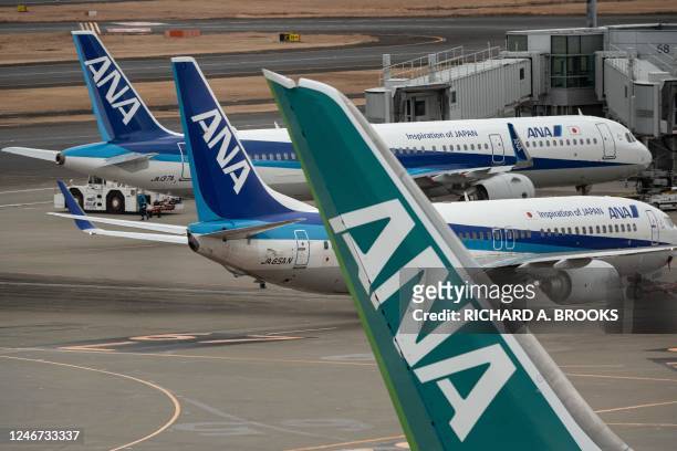 Passenger jets from Japanese carrier All Nippon Airways are seen on the tarmac at Tokyo International Airport at Haneda on February 2, 2023.