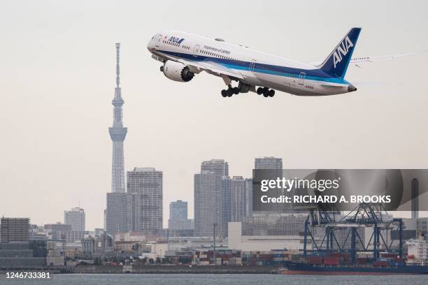 Passenger jet from Japanese carrier All Nippon Airways takes off from Tokyo International Airport at Haneda on February 2, 2023 as the Tokyo Skytree...