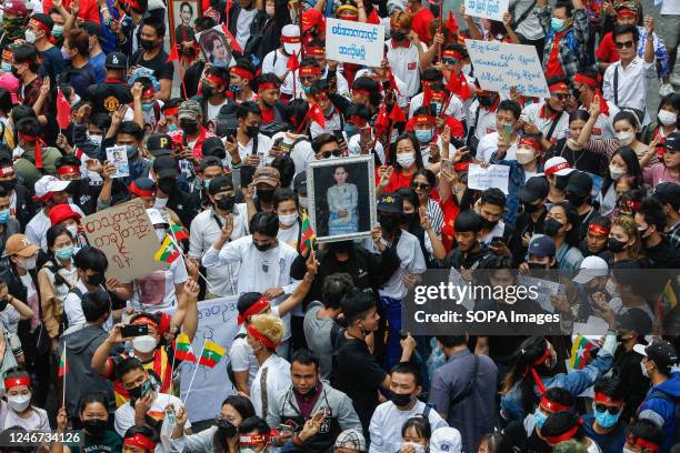 Myanmar demonstrators shout slogans against the ruling military junta during a rally to mark the second anniversary of the coup in Myanmar outside...