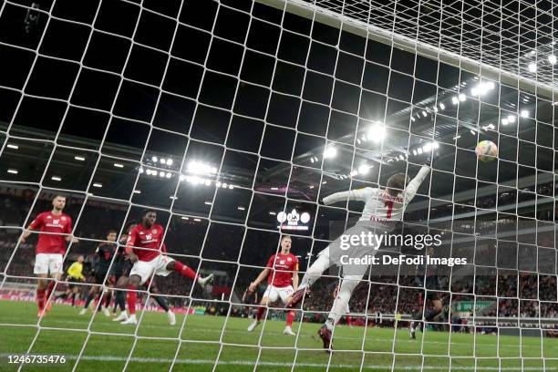 Alphonso Davies of Bayern Muenchen scores his team's fourth goal during the DFB Cup round of 16 match between 1. FSV Mainz 05 and FC Bayern München...