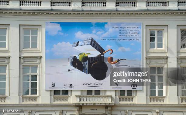 Billboard depicting works by Belgian artist Rene Magritte is displayed on the exterior of the new Magritte museum in Brussels on May 20, 2009. The...