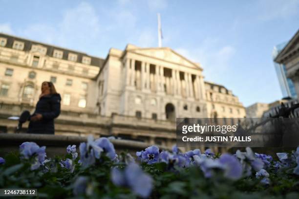 Flowers bloom outside the Bank of England, Britain's central bank, in the City of London on February 2, 2023. - The Bank of England, set to announce...