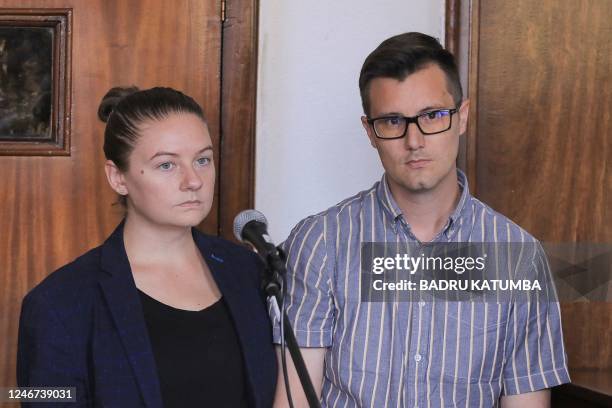 American couple, Nicholas Spencer and his wife, Mackenzie Leigh , both 32, stand in the dock at Buganda road court charged with torturing...