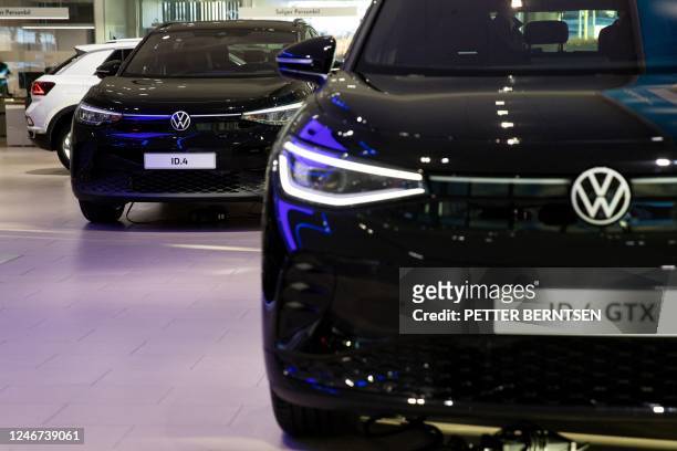 Photo taken on January 20, 2023 shows the logo of German car manufacturer Volkswagen VW on a electric Volkswagen cars ID4 and ID4 GTX at a car...