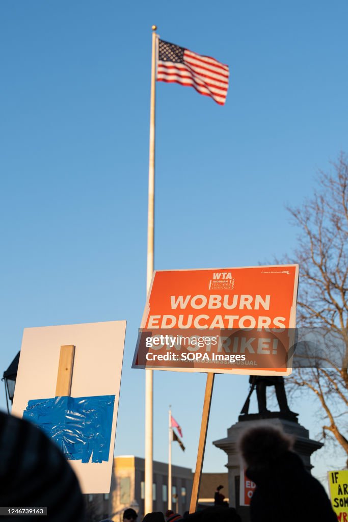 Wearable Rally Sign An educator holds a sign during a rally. Schools in Woburn,... News ...