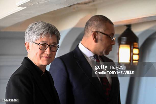 Britain's Foreign Secretary James Cleverly an his Australian counterpart Penny Wong view Lord Nelson's cabin on the British warship HMS Victory in...