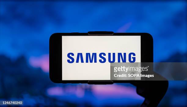 In this photo illustration, the Samsung logo is seen displayed on a mobile phone screen.