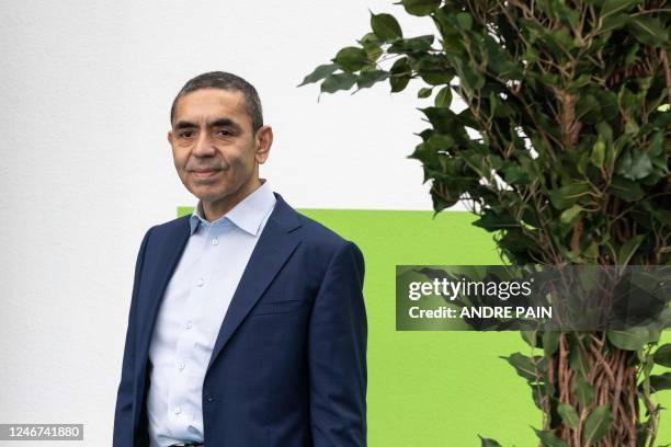 Of BioNtech Ugur Sahin look on after a press conference during the German Chancellor's visit at the German biopharmaceutical company plant BioNTech...