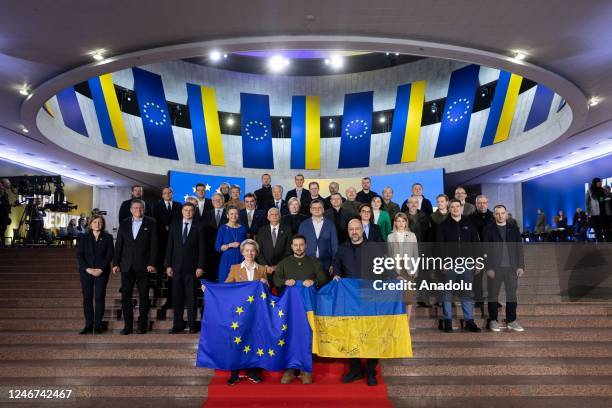 Ukrainian President Volodymyr Zelenskyy and European Commission President Ursula von der Leyen pose for a photo with Ukrainian and European Union...