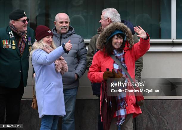 Army veterans and supporters smile and give a thumbs up sign outside Laganside Courts following former British Army soldier David Holden's sentencing...