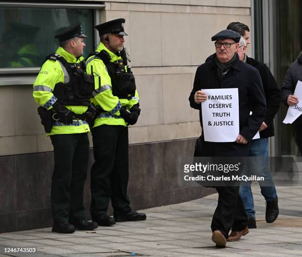 Aidan McAnespie's brother Sean McAnespie leads family members and legal representatives outside Laganside Courts following former British Army...