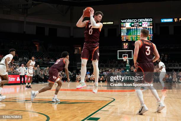 Virginia Tech Hokies guard Hunter Cattoor jumps for the ball during the game between the Miami Hurricanes and the Virginia Tech Hokies at the Watsco...