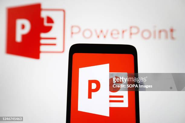 In this photo illustration, Microsoft PowerPoint logo of a software is seen on a smartphone and a pc screen.