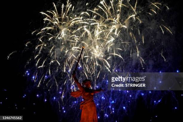 Fireworks light up the sky behind the Motherland Calls statue at the Mamayev Kurgan World War Two Memorial complex in southern city of Volgograd on...