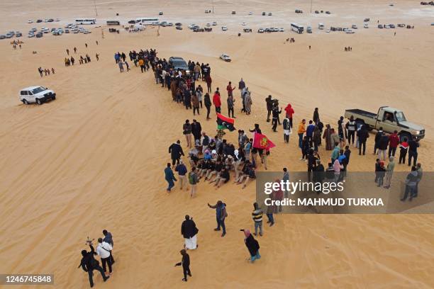 An aerial view shows people gathering in al-Ramla area near the Libyan town of Ghadames, a desert oasis some 650 kilometres southwest of the capital...