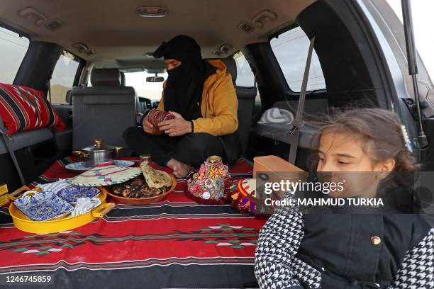 Man prepares to eat in al-Ramla area near the Libyan town of Ghadames, a desert oasis some 650 kilometres southwest of the capital Tripoli, on...