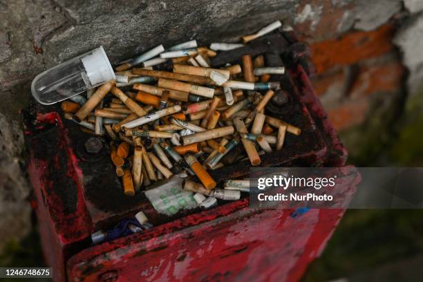 Cigarette butts left on the street basket, in the center of Krakow, Poland on February 02, 2023. In 2022, Poland's GDP increased by 4.9 percent. This...