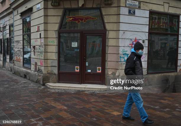 Man walks past a closed business premises in the center of Krakow, Poland on February 02, 2023. In 2022, Poland's GDP increased by 4.9 percent. This...