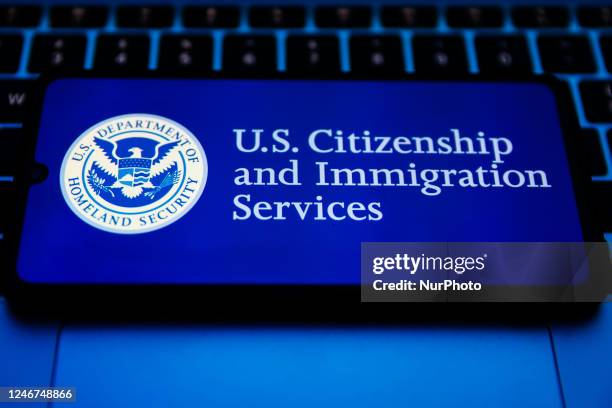 Citizenship and Immigration Services seal is displayed on a mobile phone screen for illustration photo. Krakow, Poland on February 2nd, 2023.