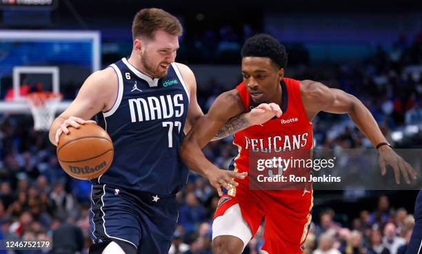 Luka Doncic of the Dallas Mavericks handles the ball as Herbert Jones of the New Orleans Pelicans defends in the first half at American Airlines...