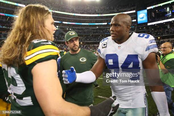 Dallas Cowboys defensive end DeMarcus Ware speaks with Green Bay Packers linebacker Clay Matthews after the Green Bay Packers against the Dallas...