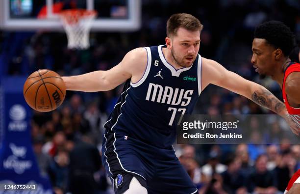 Luka Doncic of the Dallas Mavericks goes to the basket as Herbert Jones of the New Orleans Pelicans defends in the first half at American Airlines...