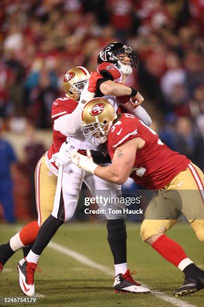 San Francisco 49ers defensive end Justin Smith and San Francisco 49ers outside linebacker Aldon Smith sandwich Atlanta Falcons quarterback Matt Ryan...