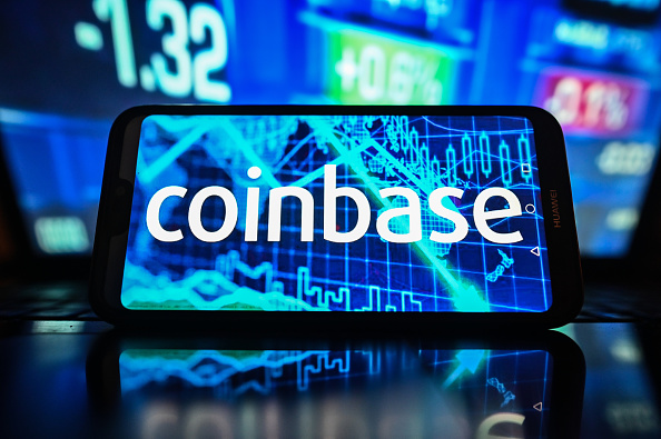Coinbase Global cut to Neutral at J.P. Morgan as crypto ETF hype