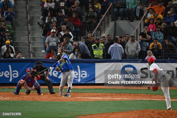 Catcher of Venezuela's Leones del Caracas Wilson Ramos hits the ball during the Caribbean Series baseball match against Panama's Federales de...