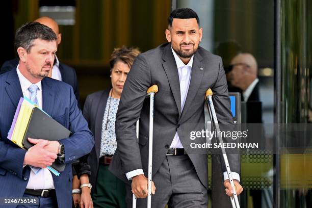 Australian tennis player Nick Kyrgios leaves the magistrate's court in Canberra on February 3, 2023. - Kyrgios on Friday pleaded guilty to assaulting...