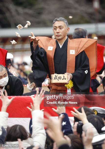 Kabuki actor Ichikawa Danjuro Hakuen scatters roasted beans during the annual "Setsubun" event marking the turn from winter to spring at Naritasan...