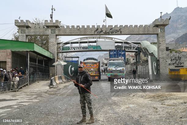 In this picture taken on February 2 a Pakistan border policeman is pictured from the zero point Torkham border crossing between Afghanistan and...