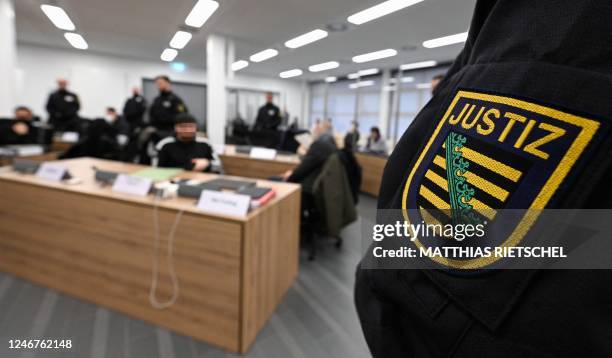 Judicial officer waits next to lawyers and defendants in the courtroom of the Higher Regional Court in Dresden, eastern Germany on February 3, 2023...