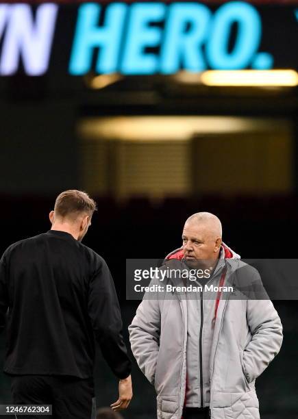 Wales , United Kingdom - 3 February 2023; Wales head coach Warren Gatland, right, speaks to Dan Biggar during the Wales rugby captain's run at...
