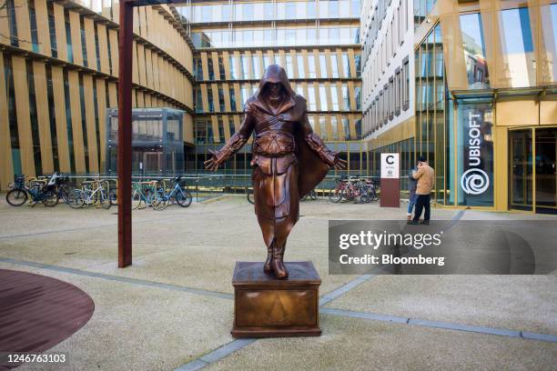 Sculpture of Ezio Auditore da Firenze, a character from the Assassin's Creed video game series, outside the Ubisoft SA headquarters in Paris, France,...