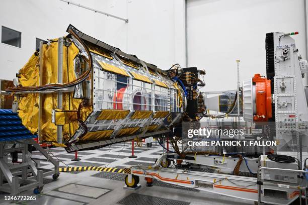 The NISAR satellite, a joint Earth-observing mission between NASA and the Indian Space Research Organization , is displayed inside a clean room at...