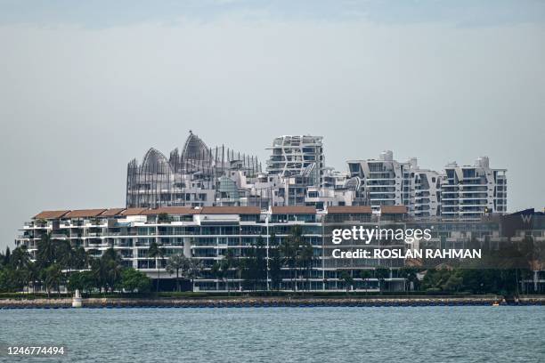 This picture taken on February 1, 2023 shows Sentosa Cove private residential housing on Sentosa Island in Singapore. - Singapore is seeing an influx...