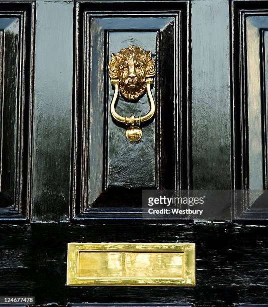 black door - door knocker stock pictures, royalty-free photos & images