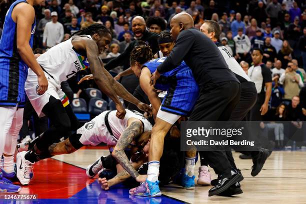Members of the Orlando Magic and Minnesota Timberwolves get into a scrum in the third quarter of the game at Target Center on February 03, 2023 in...
