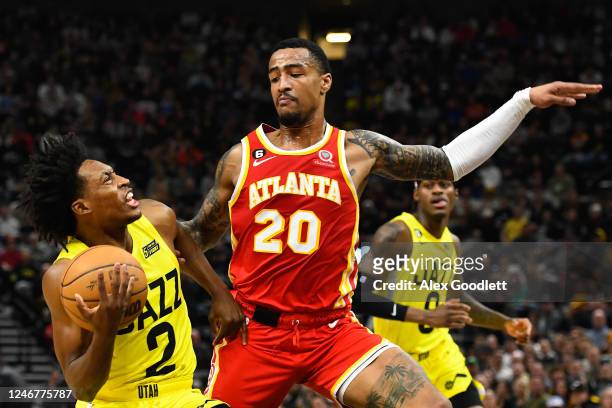 John Collins of the Atlanta Hawks defends Collin Sexton of the Utah Jazz during the first half of a game at Vivint Arena on February 03, 2023 in Salt...