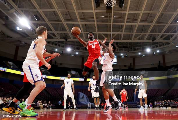 Vince Williams Jr. #5 of the Memphis Hustle drives to the basket for a layup against the Delaware Blue Coats during an NBA G-League game on February...