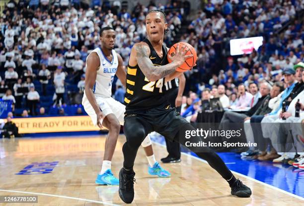 Guard Nick Kern Jr looks to pass the ball during a college basketball game between the VCU Rams and the Saint Louis Billikens on February 03 at...