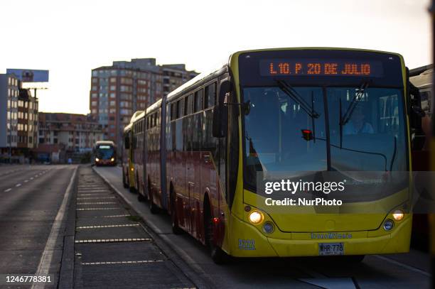 Bogota's public bus system 'Transmilenio' runs along Bogota's 'Ciclovia' during the ''No Car Day'' in Bogota, Colombia in which private cars and...