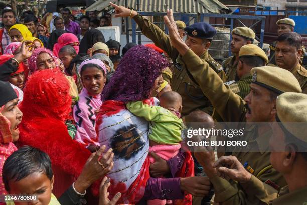 Relatives of people arrested by police for being allegedly involved in child marriages, during Assam government's state-wide crackdown on child...